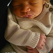 Mateo joined the competition — help win amazing prizes! newborn, baby, sleeping, knitted_clothing, cozy, hands, peaceful, infant, portrait, cute, child, soft_light, tender, closeup, person, wrapped, warm, baby_blanket, indoor, resting