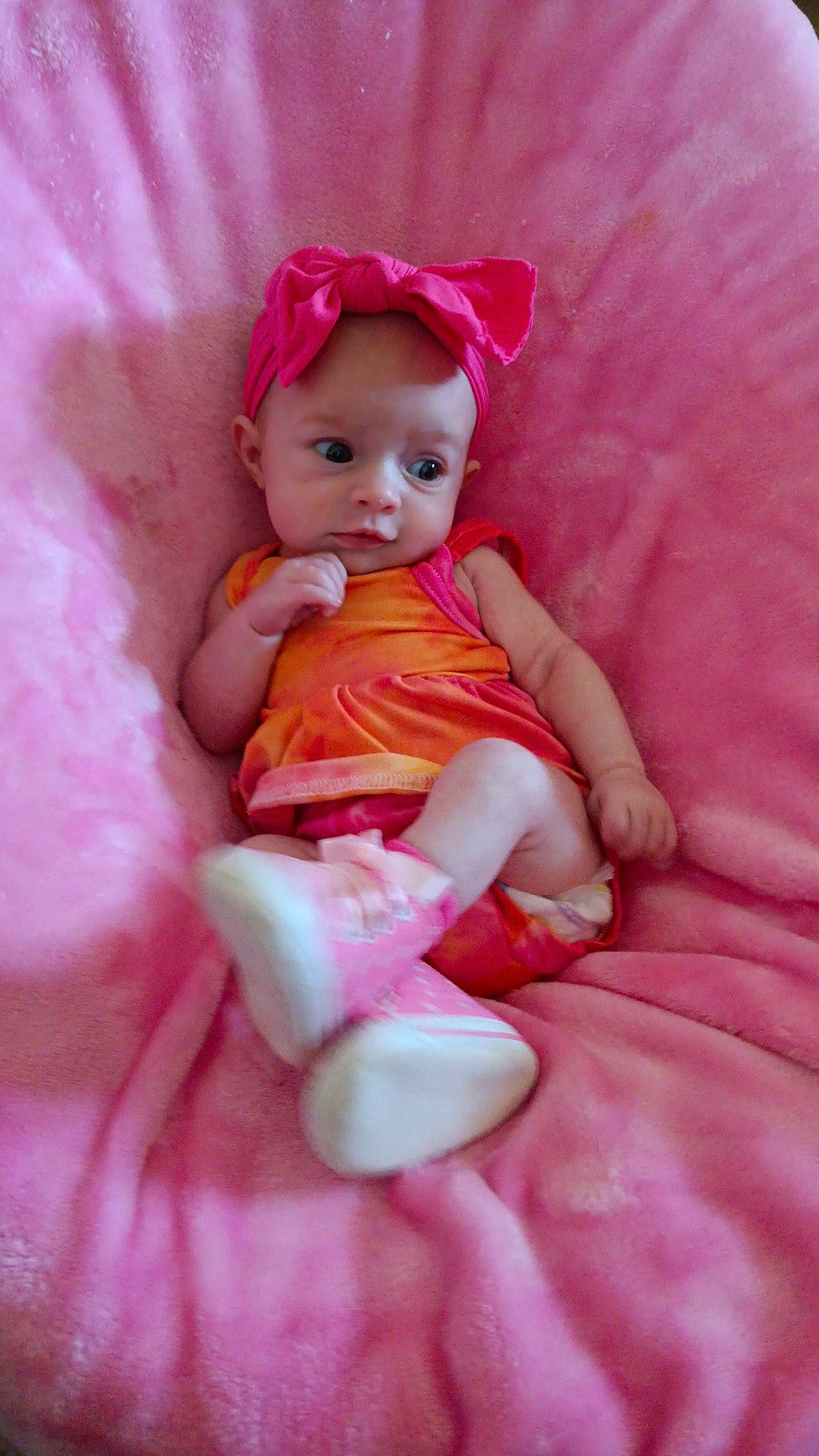 Rayne joined the competition — help win amazing prizes! baby, baby_toddler_clothing, cheek, doll, dress, embellishment, eye, human_leg, iris, lip, magenta, peach, person, petal, pink, ruffle, sitting, skin, sleeve, toddler