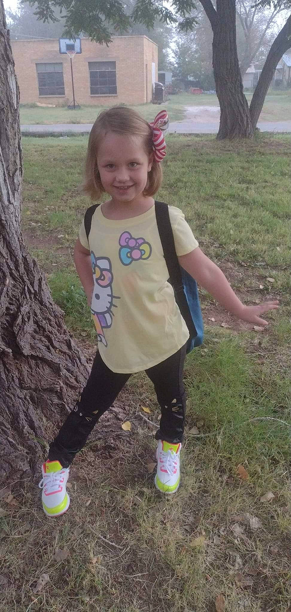 Daisy Mae Ann joined the competition — help win amazing prizes! blond, footwear, fun, grass, happy, joy, pattern, people_in_nature, person, pink, plant, recreation, shoe, sleeve, smile, sneakers, sock, sweatpant, t_shirt, thigh