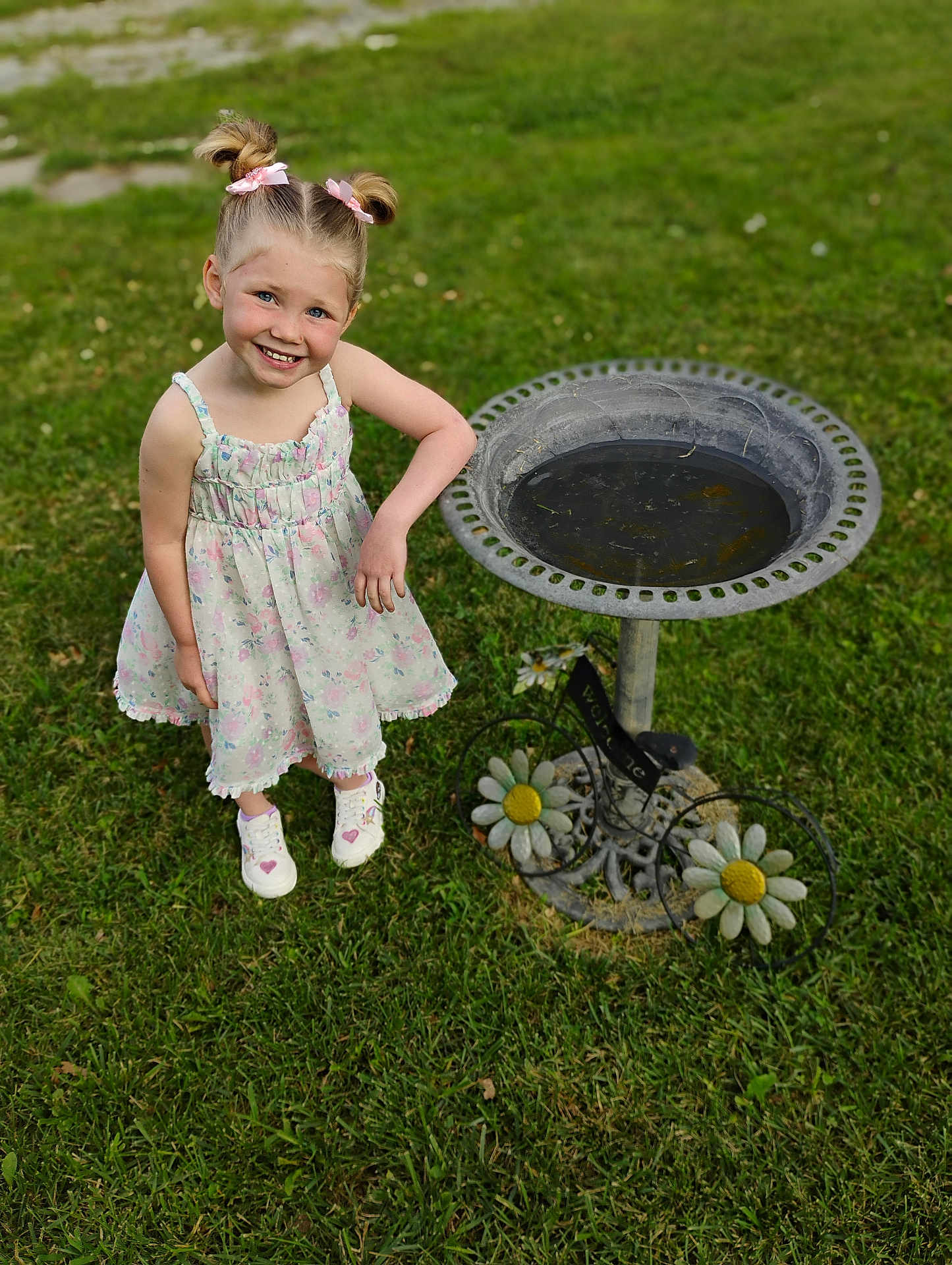 Hermonie joined the competition — help win amazing prizes! child, girl, smile, dress, hair_bows, grass, birdbath, flower_decor, outdoor, sunny, happy, playful, young, cute, shoes, greenery, nature, portrait, daylight, garden
