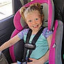 Hermonie is registered to the contest to win money with this photo: child, car_seat, smiling, blonde_hair, pigtails, seatbelt, car_interior, blue_eyes, happy, safety, casual_clothing, pink, gray, young_child, portrait, seat, vehicle, daylight, cute, child_safety