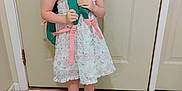 Hermonie is registered to the contest to win money with this photo: backpack, casual, child, cute, door, floor_tiles, floral_dress, girl, happy, home, indoor, person, pigtails, pink_ribbons, ready, shoes, smile, standing, white_shoes, young