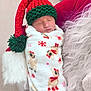 baby, blanket, christmas, cozy, cushion, cute, festive, fluffy, green_hat, holiday, infant, knitted_hat, newborn, pom_pom, red_hat, reindeer_pattern, resting, sleeping, snowflakes, wrapped