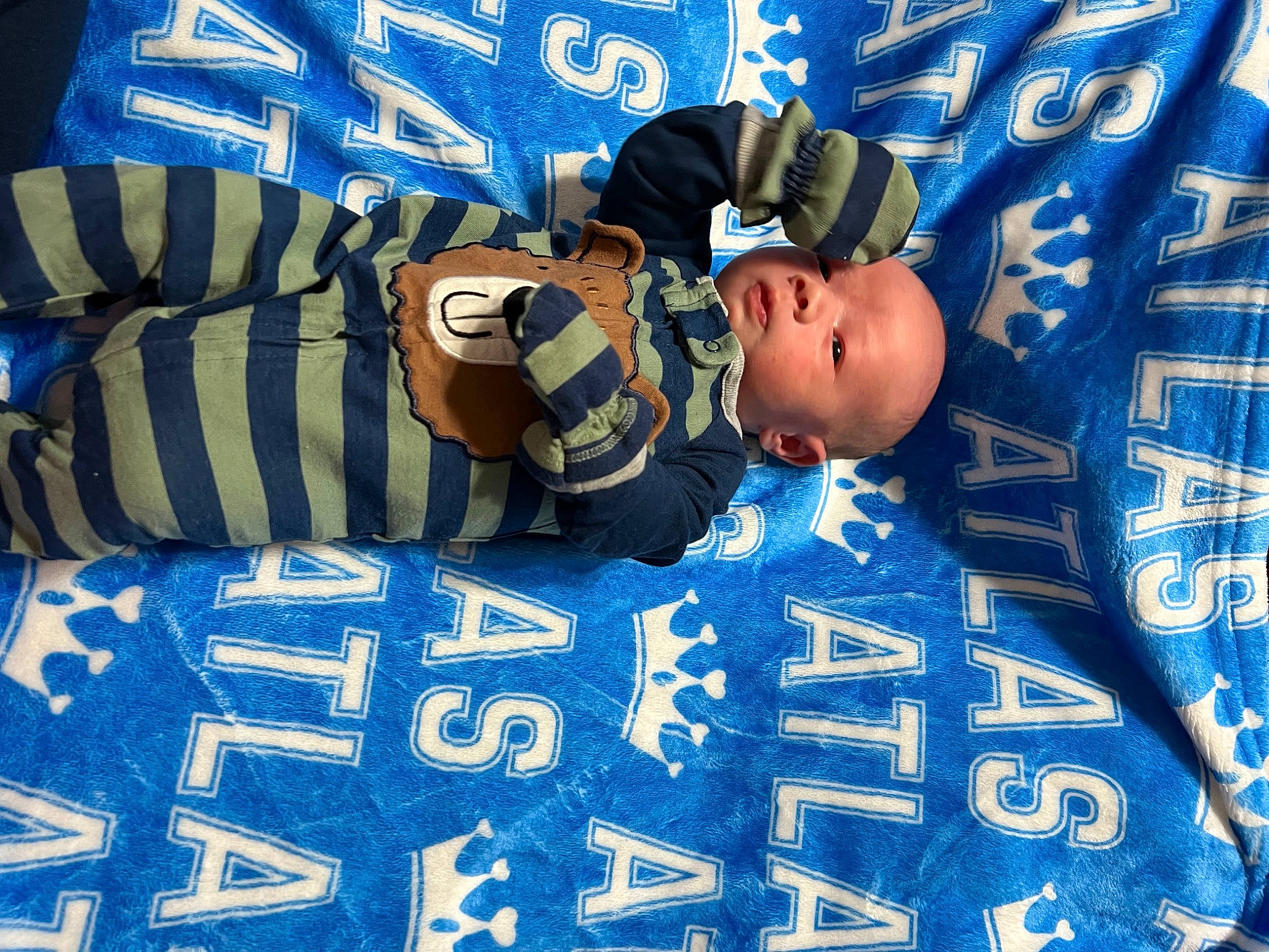 Atlas is registered to the contest to win money with this photo: azure, baby, baby_toddler_clothing, blue, child, cool, electric_blue, event, flag_of_the_united_states, font, fun, happy, number, pattern, person, product, sleeve, smile, textile, toddler