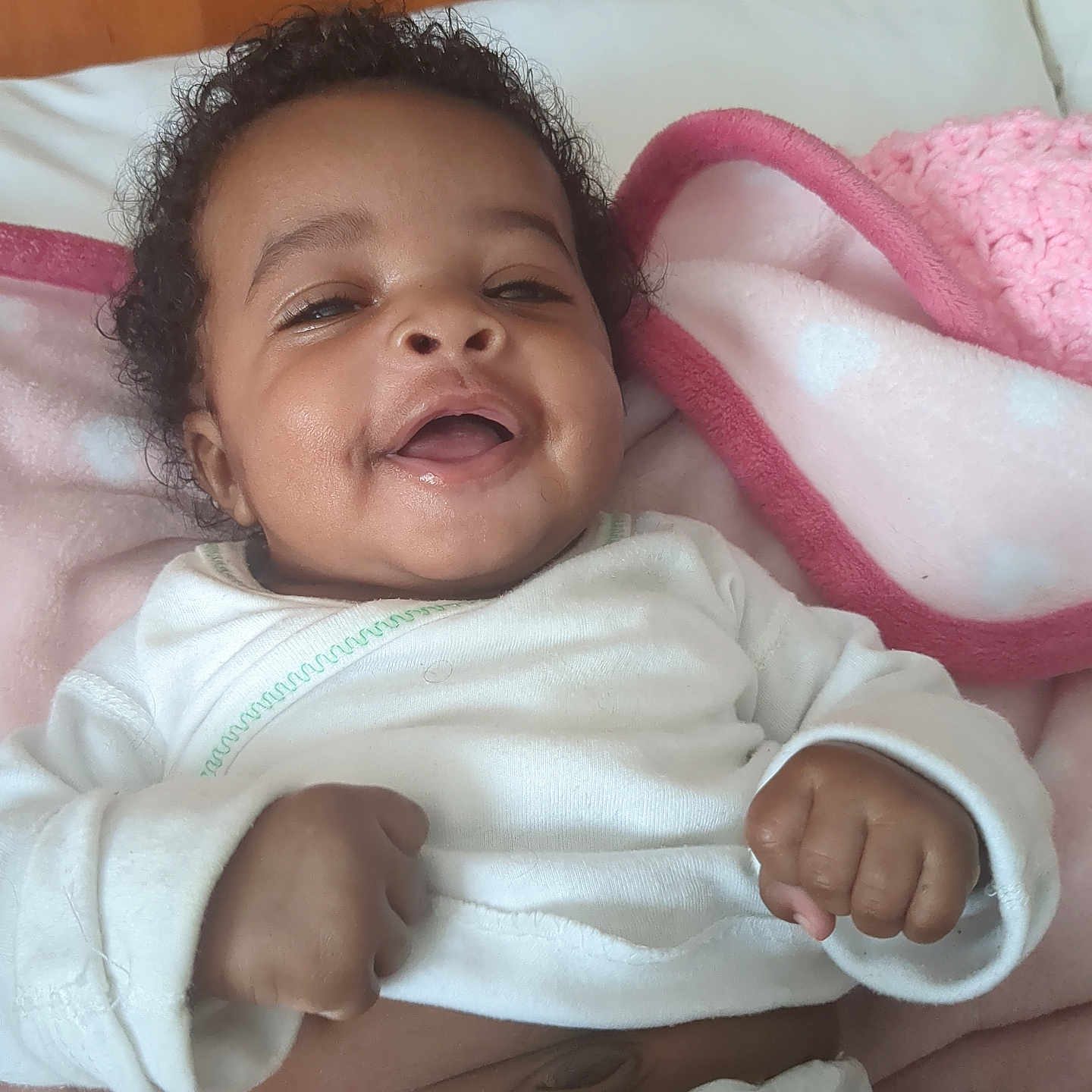 Rah'Ya joined the competition — help win amazing prizes! baby, babylaughing, bed, blanket, bodypart, couch, crib, cushion, face, finger, furniture, hand, happy, head, infantbed, newborn, person, photography, portrait, smile