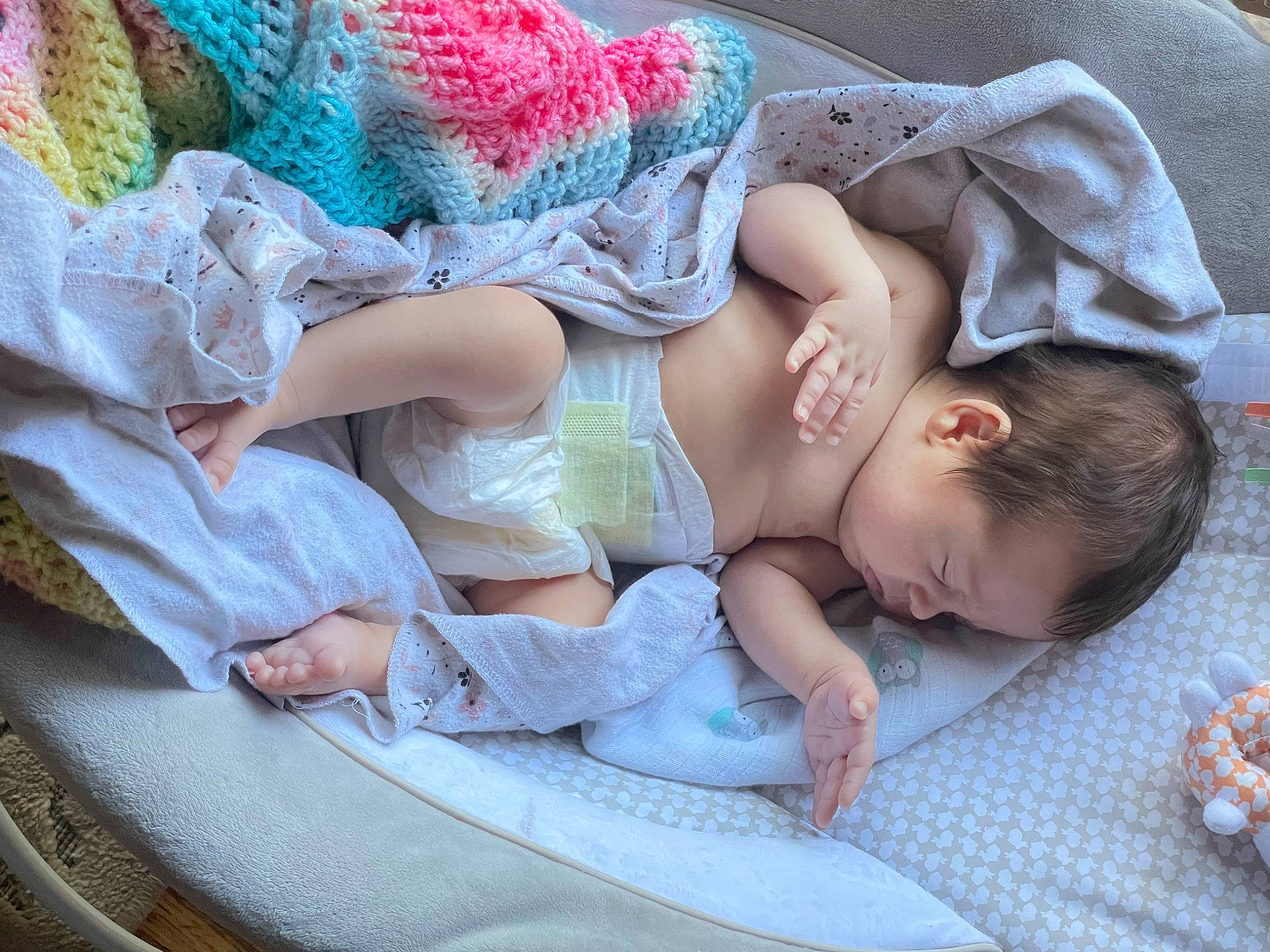 Daphne is registered to the contest to win money with this photo: arm, baby, baby_products, baby_sleeping, baby_toddler_clothing, bedding, bedtime, child, comfort, hand, human_body, linens, nap, pattern, person, pink, room, sitting, sleep, textile