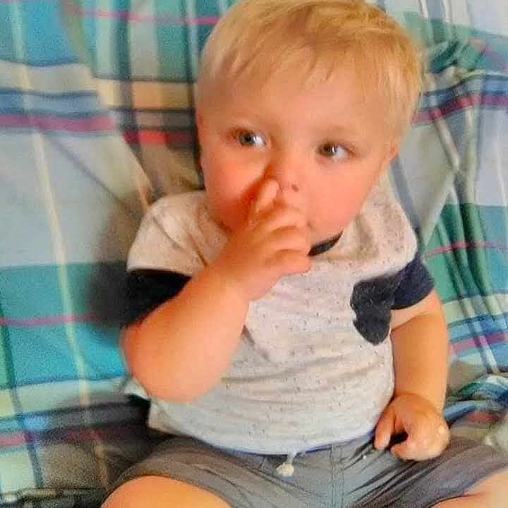 Alyjah joined the competition — help win amazing prizes! baby, blonde_hair, casual_clothing, child, cute, face, furniture, hand, indoor, legs, nose, person, plaid_blanket, portrait, shorts, sitting, skin, toddler, tshirt, young_child