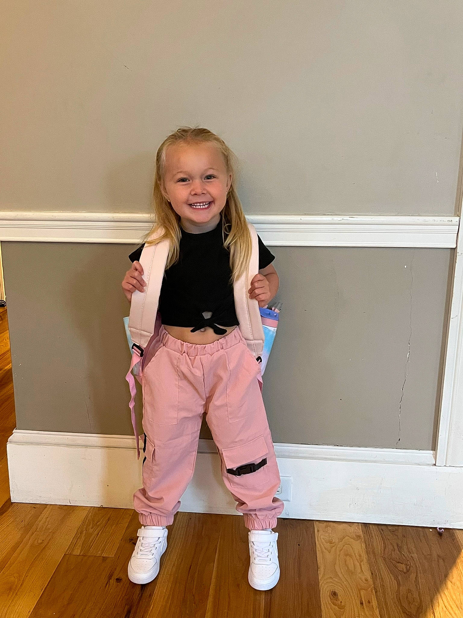 Remi joined the competition — help win amazing prizes! baby_toddler_clothing, face, floor, flooring, happy, hardwood, human_leg, joy, knee, laminate_flooring, leg, long_hair, person, shoe, sleeve, smile, sock, thigh, toddler, waist