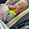 Linley joined the competition — help win amazing prizes! baby, car_seat, teether, blanket, infant, child, cute, hand, face, blue_eyes, clothing, safety_label, car_interior, soft_toy, comfort, close_up, portrait, cute_expression, indoor, newborn