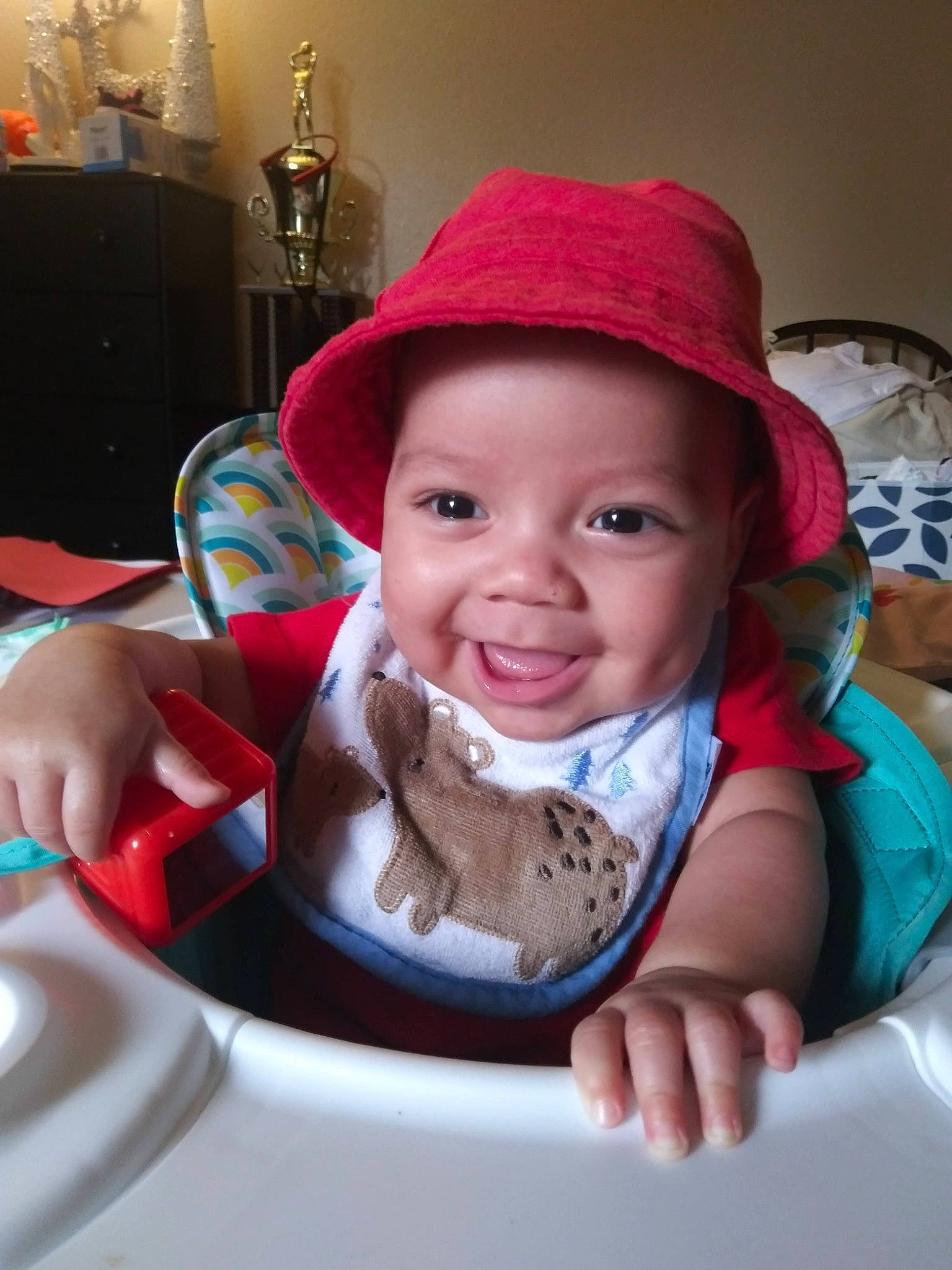 Emmitt is registered to the contest to win money with this photo: baby, baby_toddler_clothing, cap, cheek, child, chin, dishware, drinkware, eye, food, fun, happy, headwear, joy, lip, mouth, person, plate, serveware, skin
