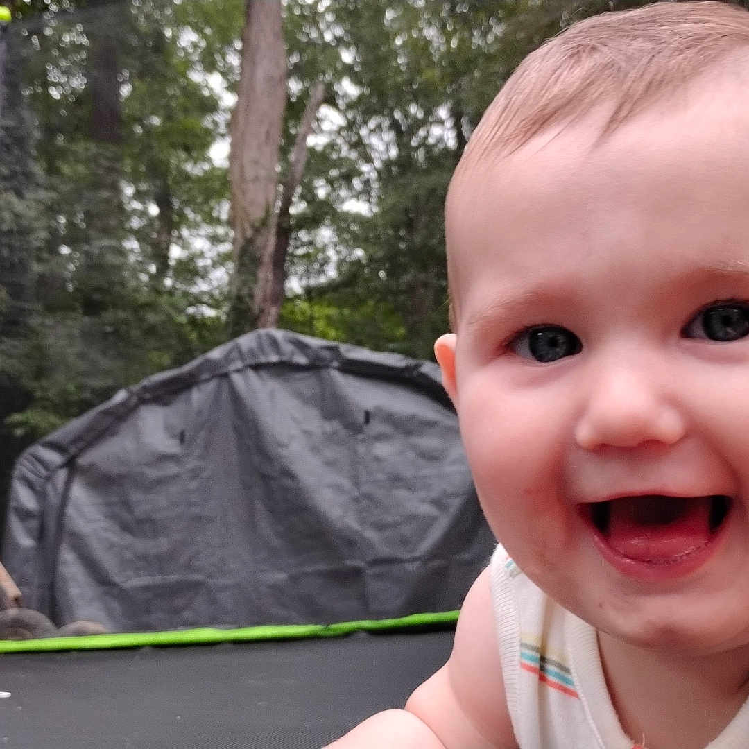 Onixx joined the competition — help win amazing prizes! baby, child, closeup, crawling, cute, daylight, face, grass, happy, infant, nature, outdoor, person, play, skin, smiling, summer, tank_top, trampoline, trees