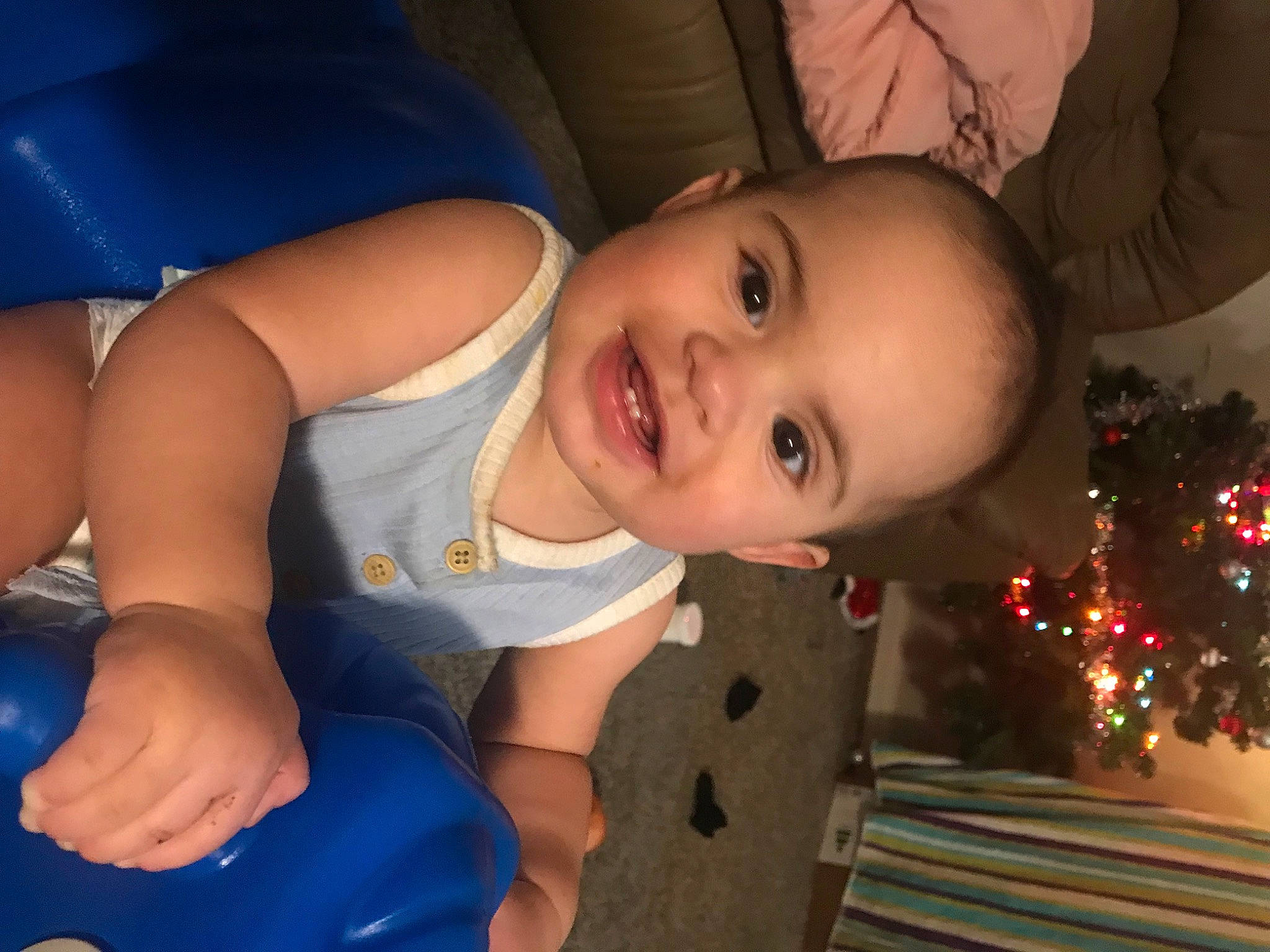 Celia joined the competition — help win amazing prizes! baby_toddler_clothing, blue, cheek, child, christmas_tree, eye, facial_expression, fun, hairstyle, happy, head, human_body, joy, mouth, nose, person, skin, smile, toddler, tree