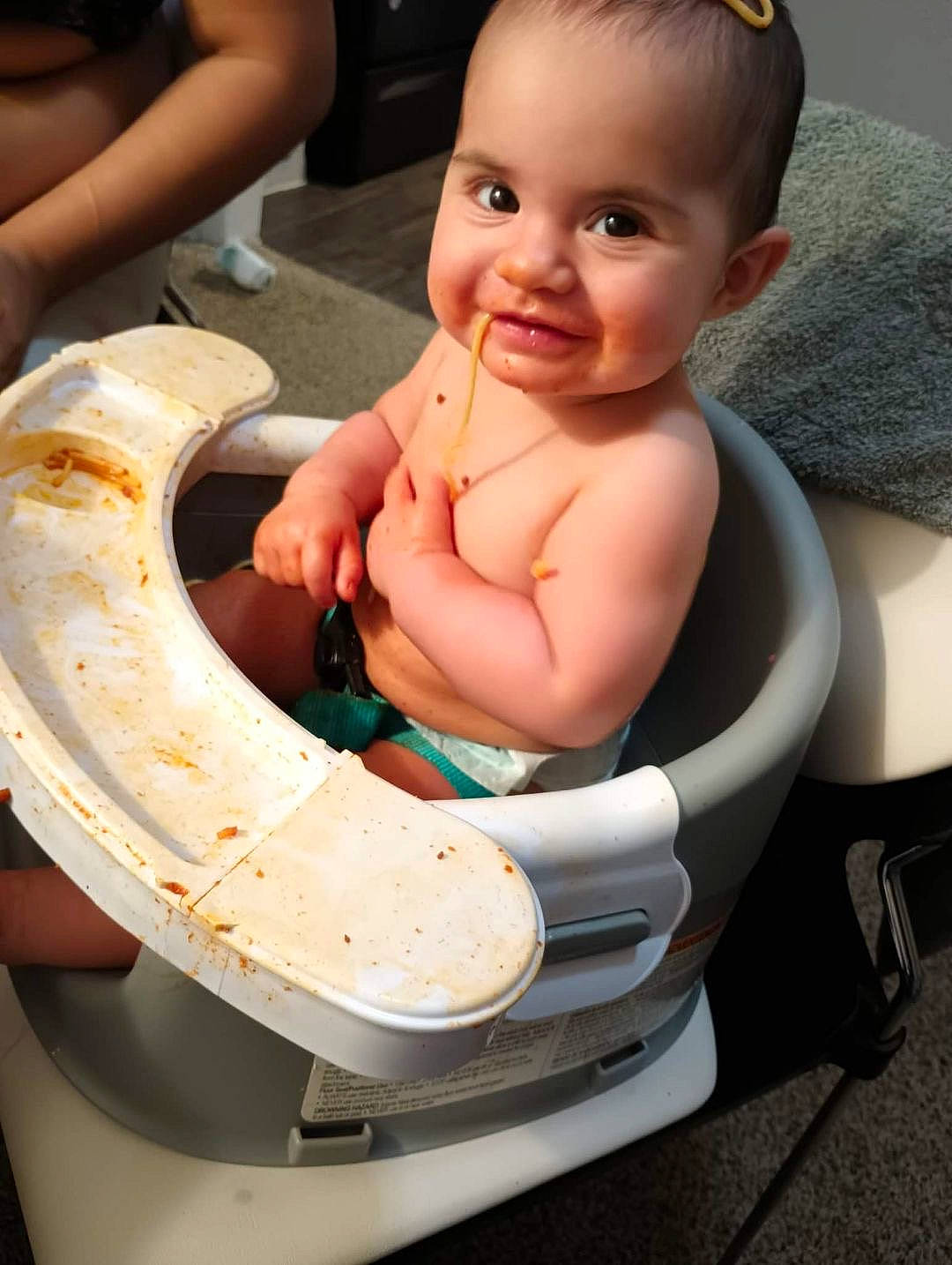 Celia is registered to the contest to win money with this photo: auto_part, automotive_wheel_system, baby, baby_products, baby_toddler_clothing, chair, cheek, child, dishware, eyelash, fun, hairstyle, hand, happy, head, joy, person, skin, smile, table