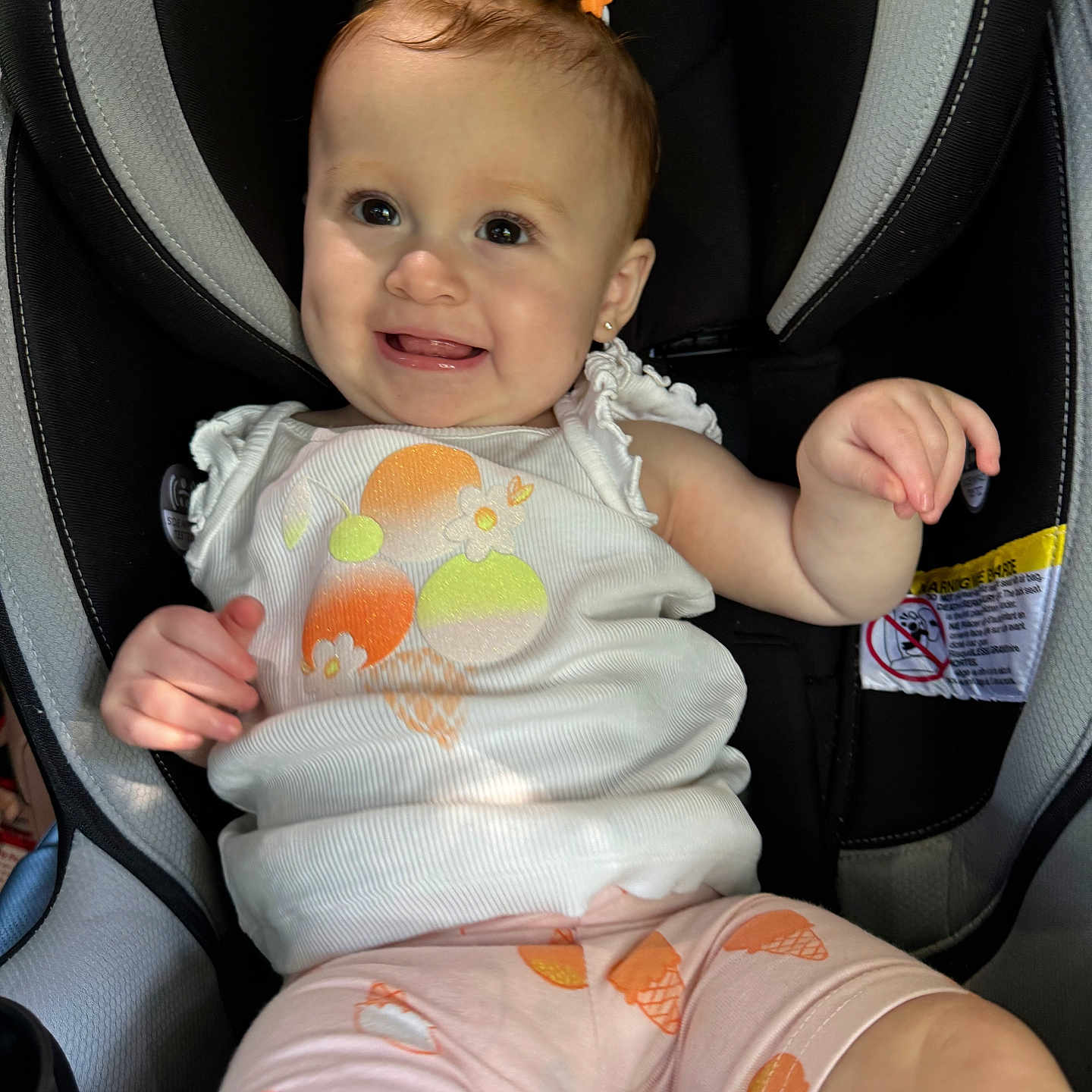 Iylah is registered to the contest to win money with this photo: baby, bodypart, car, car_interior, carseat, clothing, cushion, face, finger, hand, head, homedecor, person, photography, portrait, shorts, sitting, t_shirt, transportation, vehicle