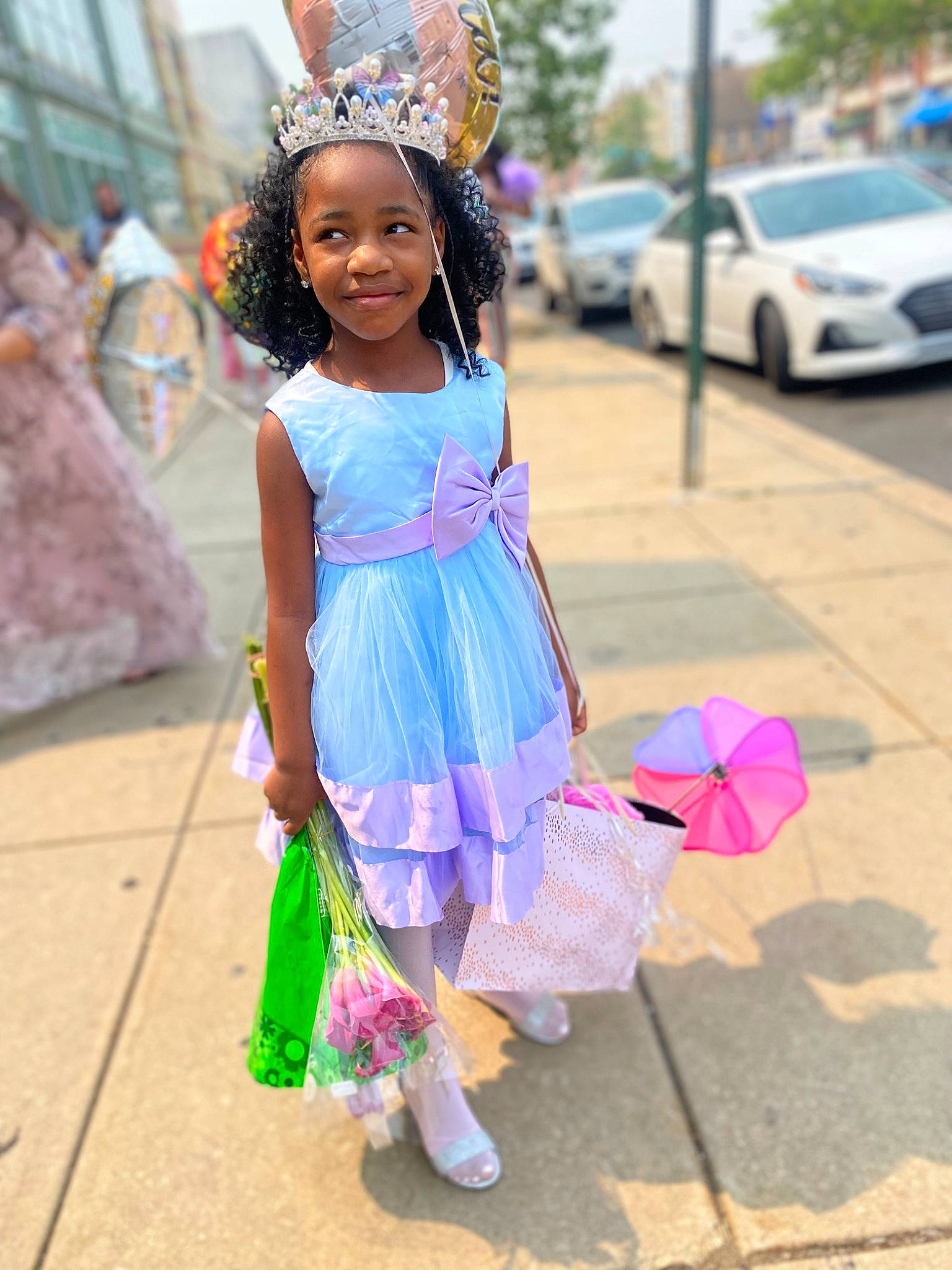 Kennedy is registered to the contest to win money with this photo: beauty, car, child, costume, dress, electric_blue, event, fun, happy, joy, magenta, person, pink, purple, recreation, sandal, smile, street, summer, tire
