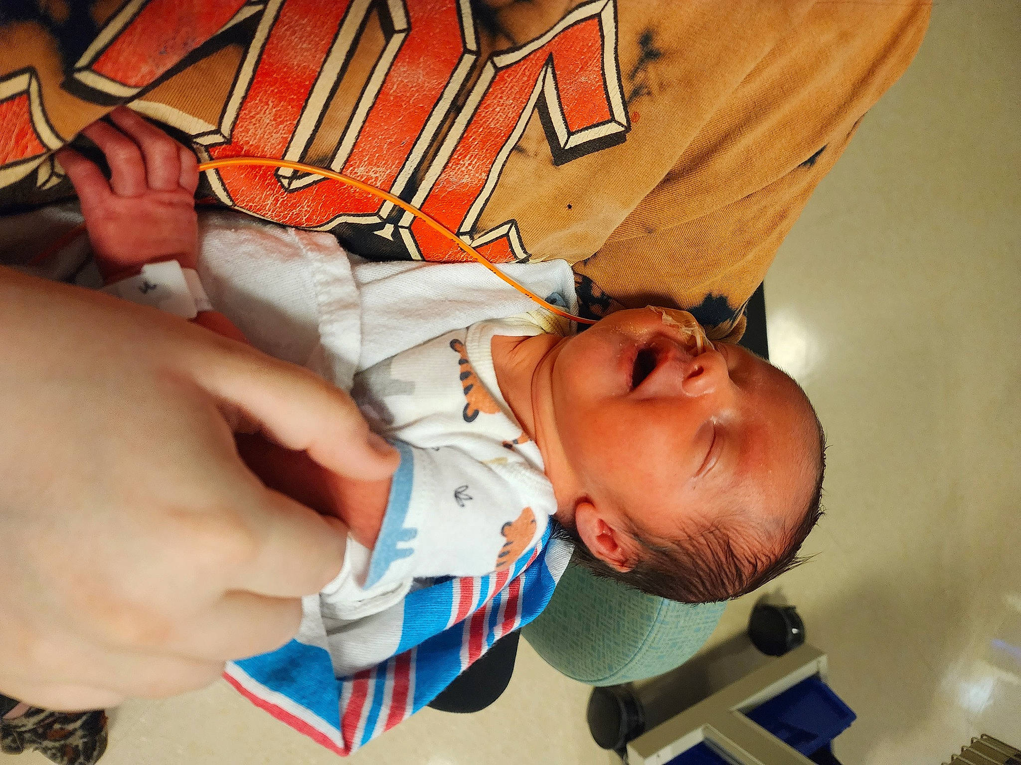 Emmett is registered to the contest to win money with this photo: baby, baby_sleeping, baby_toddler_clothing, child, comfort, elbow, finger, font, fun, gesture, hand, happy, junk_food, linens, nail, person, room, t_shirt, thumb, toddler