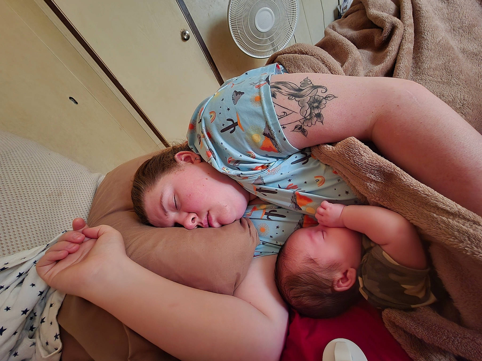 Emmett is registered to the contest to win money with this photo: abdomen, arm, baby, cheek, chest, child, comfort, eye, finger, gesture, hand, head, human_body, muscle, person, skin, stomach, thumb, toddler, trunk