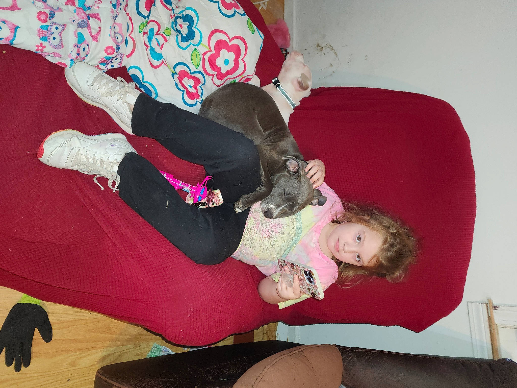Layken is registered to the contest to win money with this photo: boot, child, comfort, fun, human_leg, knee, lap, linens, magenta, person, pink, room, sitting, sock, sportswear, thigh, toddler