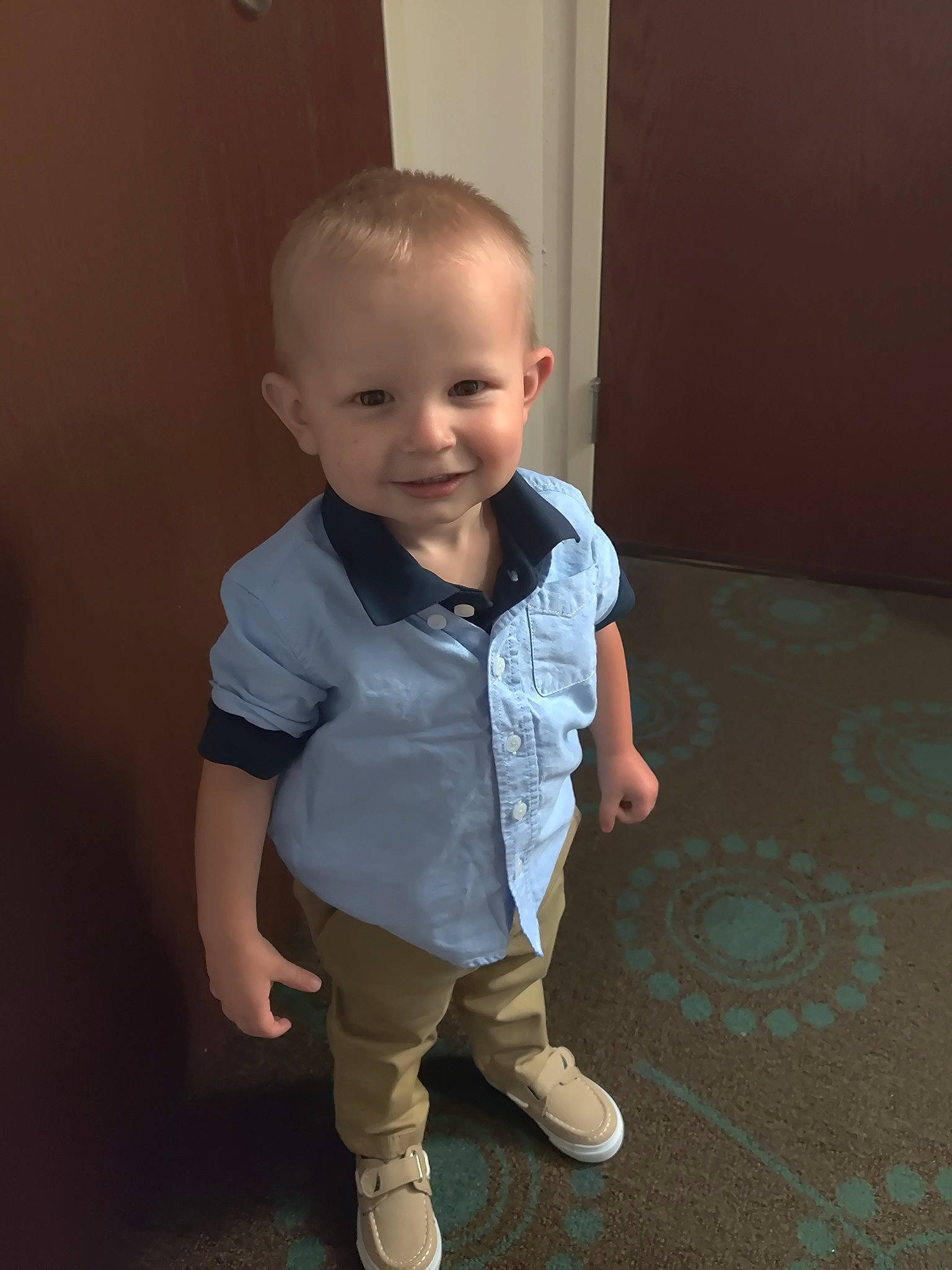 Stryker is registered to the contest to win money with this photo: baby, baby_toddler_clothing, cheek, chin, dress_shirt, floor, flooring, fun, happy, hardwood, human_body, iris, joint, joy, leg, nose, person, skin, sleeve, smile