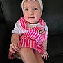 baby, child, girl, headband, flower, pink_dress, striped_clothing, barbie, blue_eyes, couch, black_leather, sitting, innocence, cute, portrait, hand, legs, white_shirt, happy, indoor