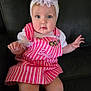 baby, child, girl, headband, flower, pink_dress, striped_clothing, barbie, heart_patch, sitting, couch, indoor, cute, portrait, blue_eyes, white_shirt, infant, hand, face, looking
