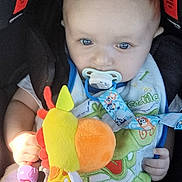 Jacob is registered to the contest to win money with this photo: baby, car, clothing, costume, cream, cushion, cutlery, dessert, face, food, head, homedecor, person, photography, plush, portrait, spoon, toy, transportation, vehicle