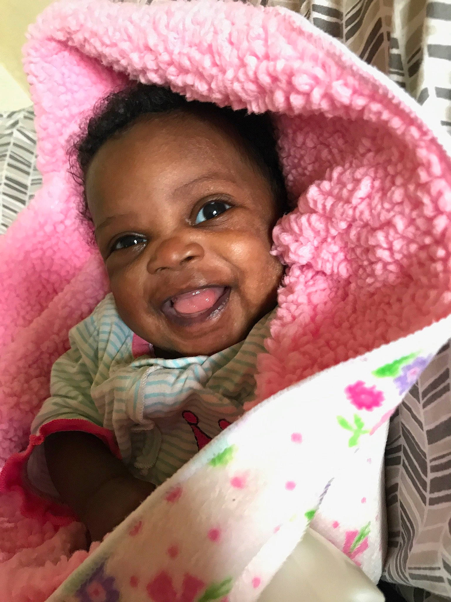 Ramiya is registered to the contest to win money with this photo: baby, cheek, child, eye, joy, linens, lip, person, pink, skin, smile, textile, toddler