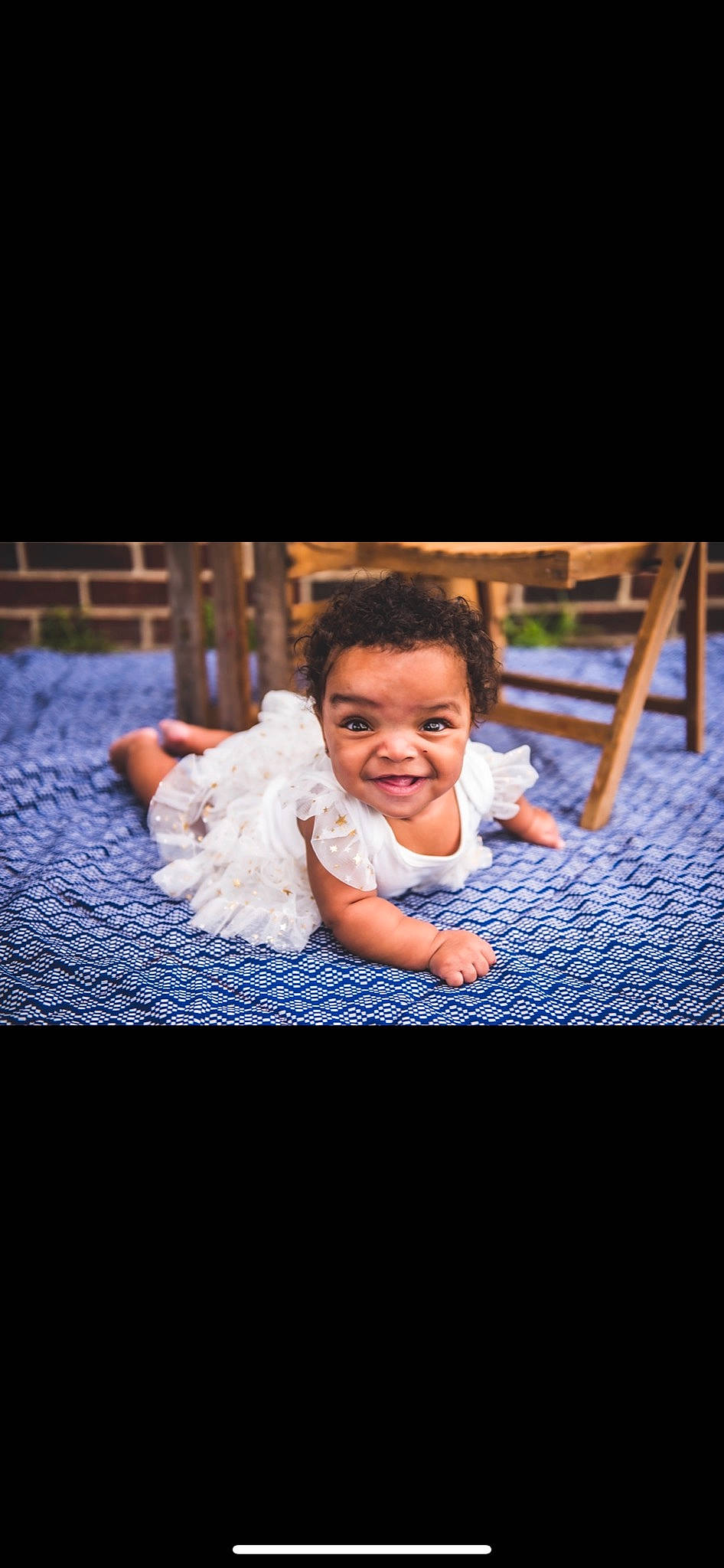 Nyomi joined the competition — help win amazing prizes! baby, baby_toddler_clothing, child, comfort, darkness, flash_photography, flooring, fun, grass, happy, joy, laugh, leisure, person, portrait_photography, room, sitting, smile, t_shirt, toddler