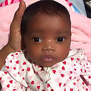 Journee is registered to the contest to win money with this photo: baby, infant, child, face, hand, onesie, heart_pattern, blanket, cozy, cute, portrait, newborn, sleepwear, soft, indoor, human, skin, expression, adorable, warm