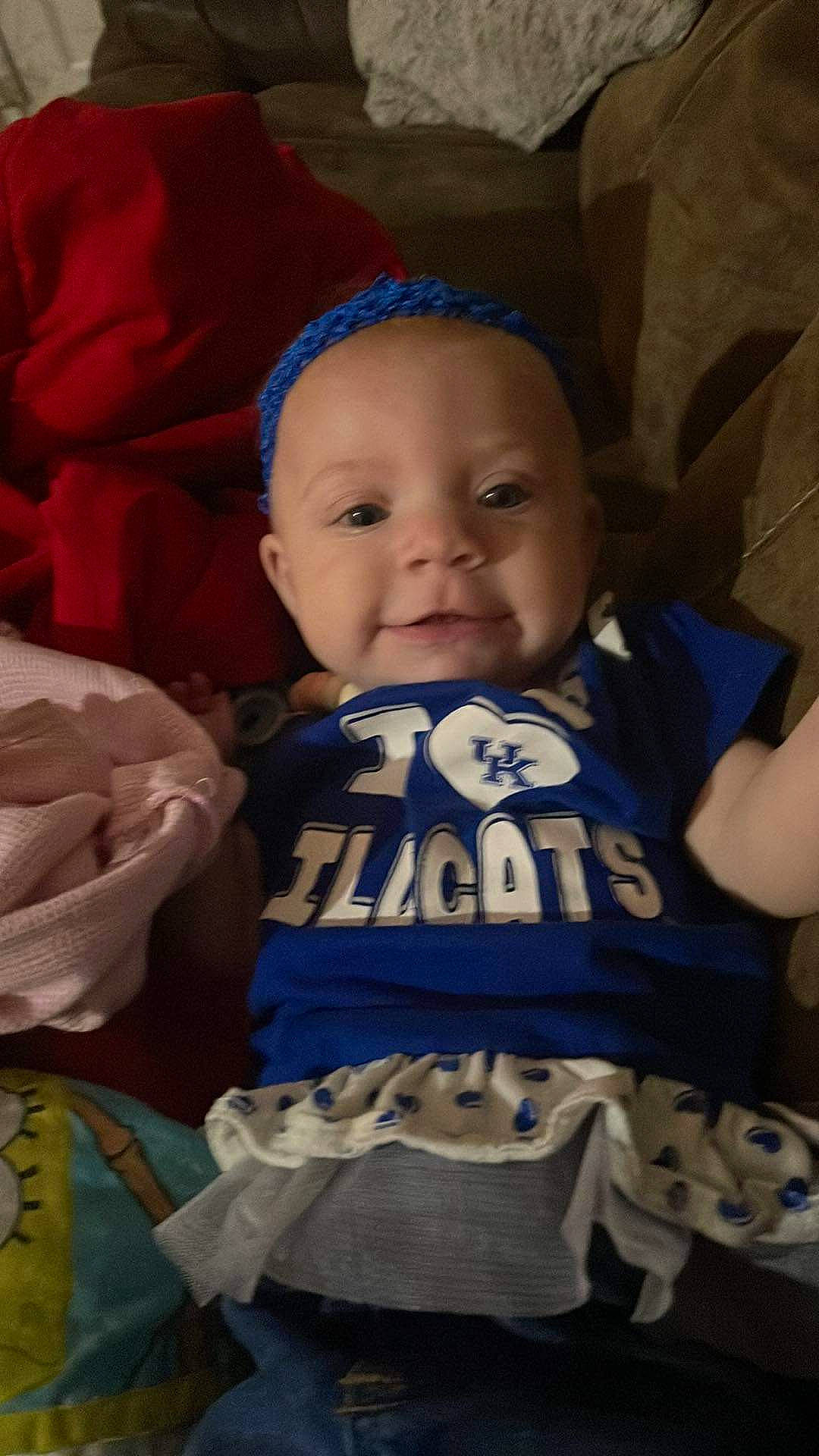 Harlow joined the competition — help win amazing prizes! baby, baby_products, baby_toddler_clothing, cheek, child, electric_blue, face, fun, happy, head, linens, mouth, person, personal_protective_equipment, product, sitting, sleeve, smile, t_shirt, textile