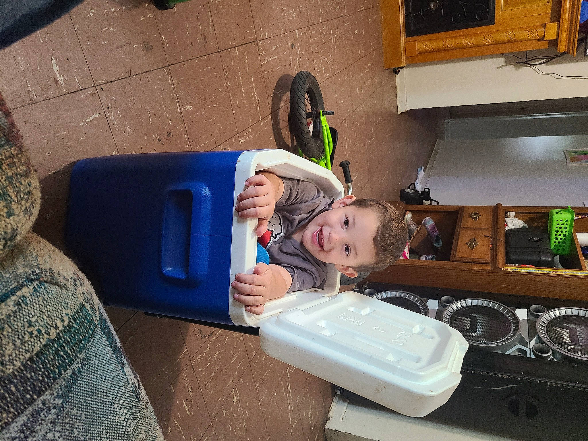 Miguel is registered to the contest to win money with this photo: baby, cabinetry, child, electric_blue, finger, flooring, fun, home_appliance, joy, kitchen, kitchen_appliance, machine, major_appliance, microwave_oven, person, picture_frame, play, room, sitting, toddler