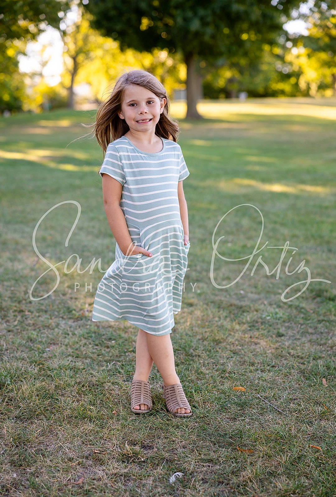 Skylynn is registered to the contest to win money with this photo: day_dress, dress, facial_expression, flash_photography, grass, grassland, happy, joy, leaf, leisure, long_hair, meadow, people_in_nature, person, plant, smile, standing, summer, sunlight, tree