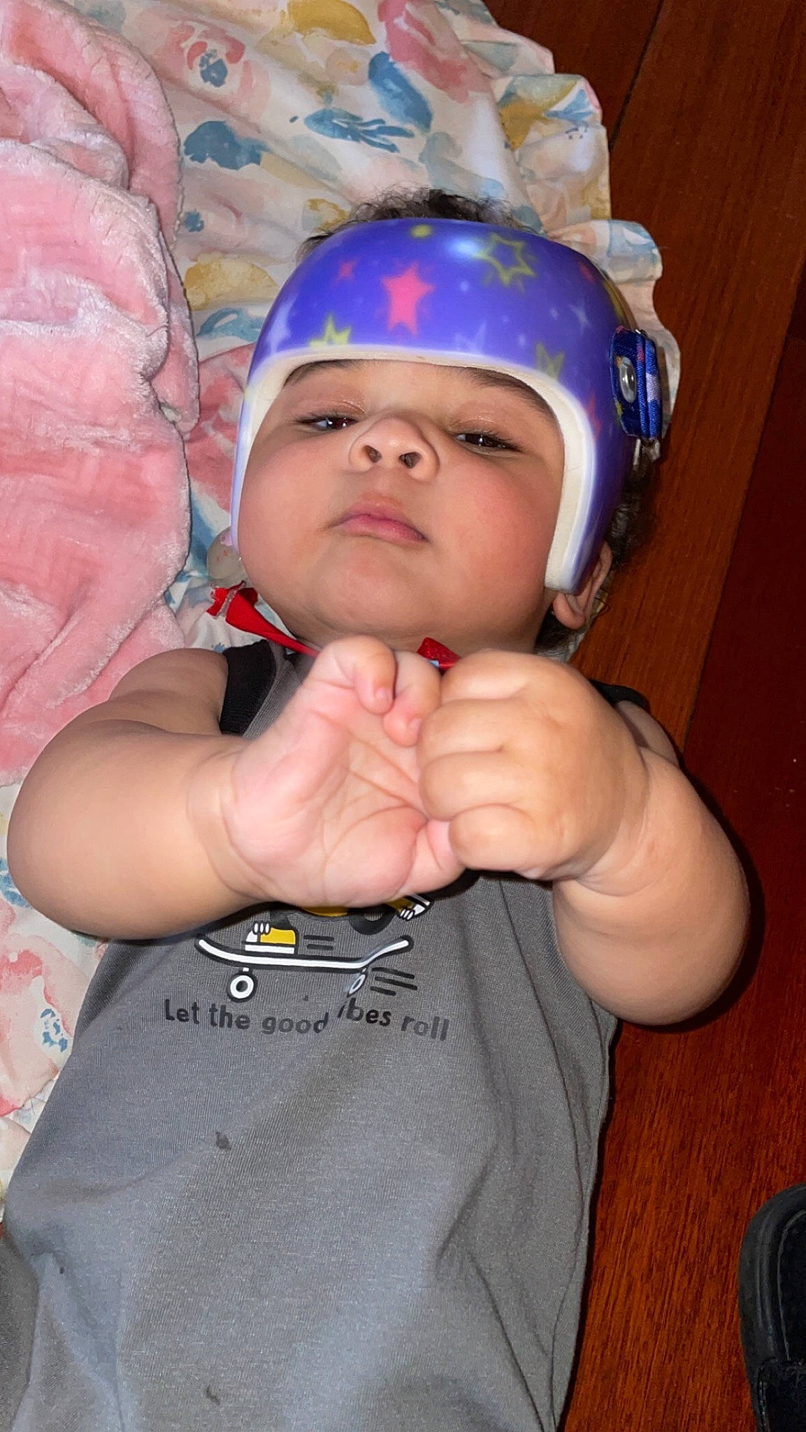 Amari is registered to the contest to win money with this photo: baby, cap, child, costume_hat, electric_blue, fashion_accessory, finger, fun, gesture, happy, headwear, helmet, jewellery, nail, party_supply, person, personal_protective_equipment, sleeve, sports_gear, t_shirt