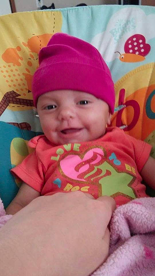 Harmony Cruz joined the competition — help win amazing prizes! baby, baby_toddler_clothing, cap, cheek, eye, face, facial_expression, finger, fun, happy, head, headwear, lip, magenta, mouth, person, pink, product, skin, smile