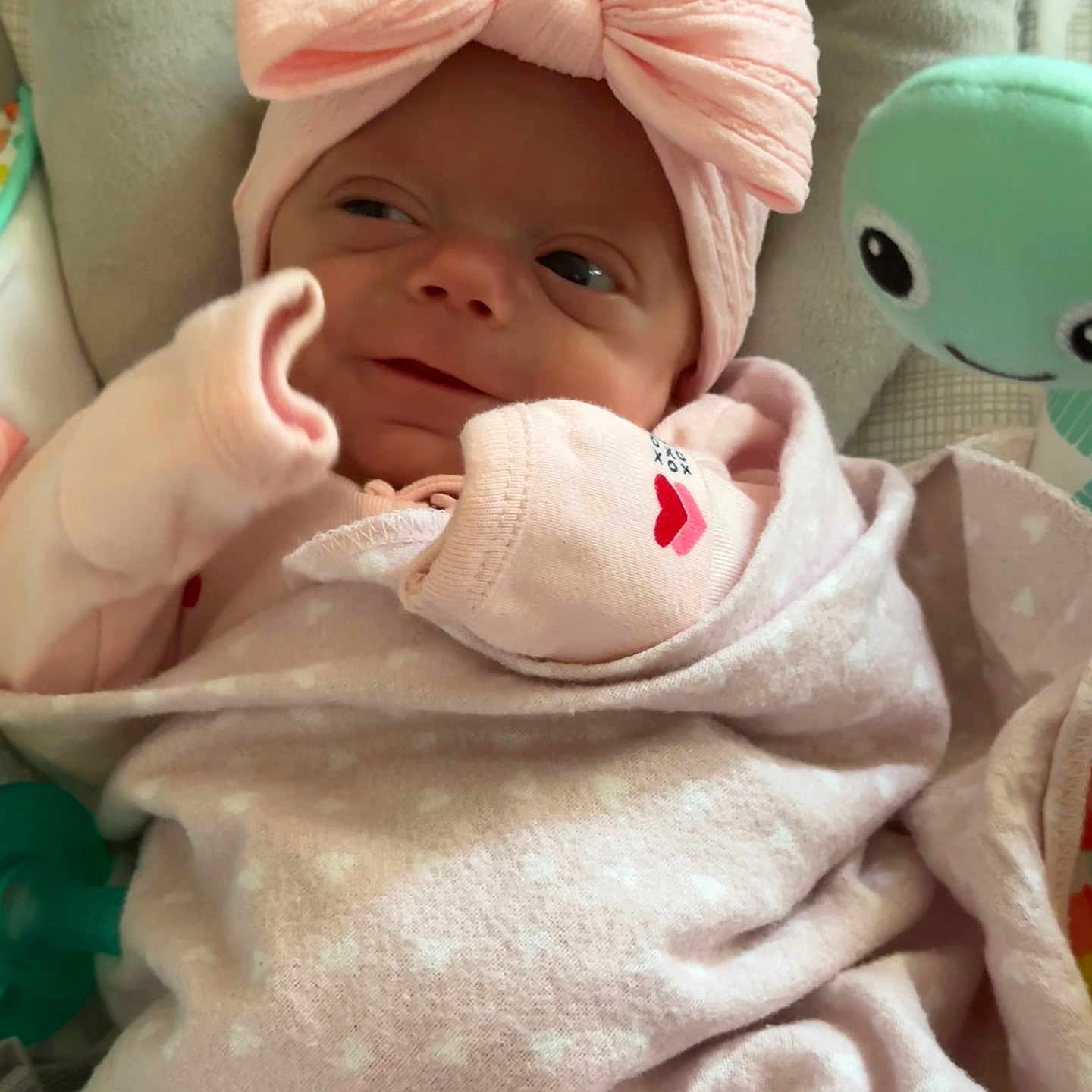 Amelia Faith is registered to the contest to win money with this photo: baby, blanket, clothing, cushion, face, happy, hat, head, homedecor, newborn, person, smile