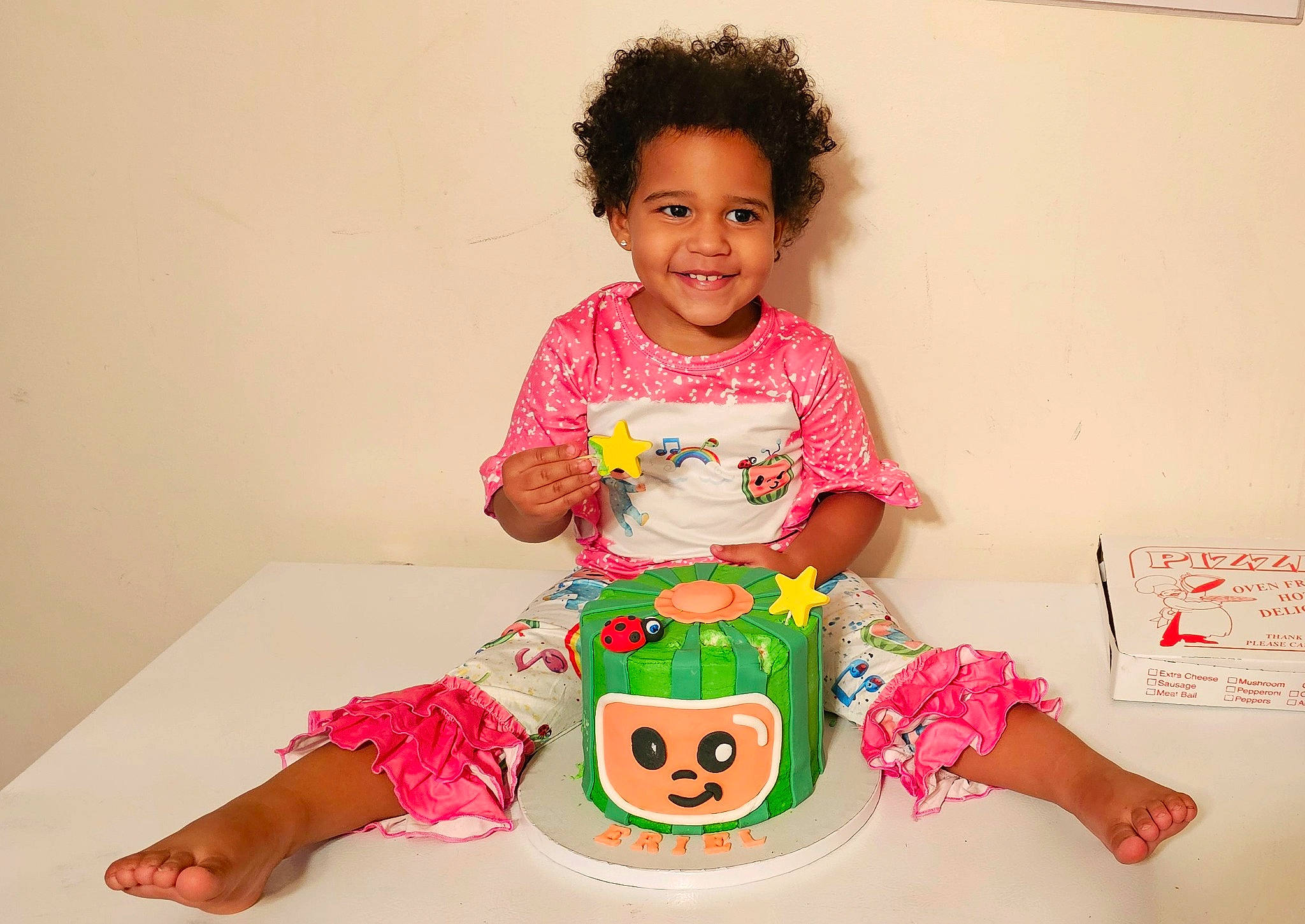 Eriel is registered to the contest to win money with this photo: baby, baby_toddler_clothing, birthday, child, fun, happy, joy, magenta, party, pattern, peach, person, pink, play, shorts, sitting, sleeve, smile, sweetness, t_shirt