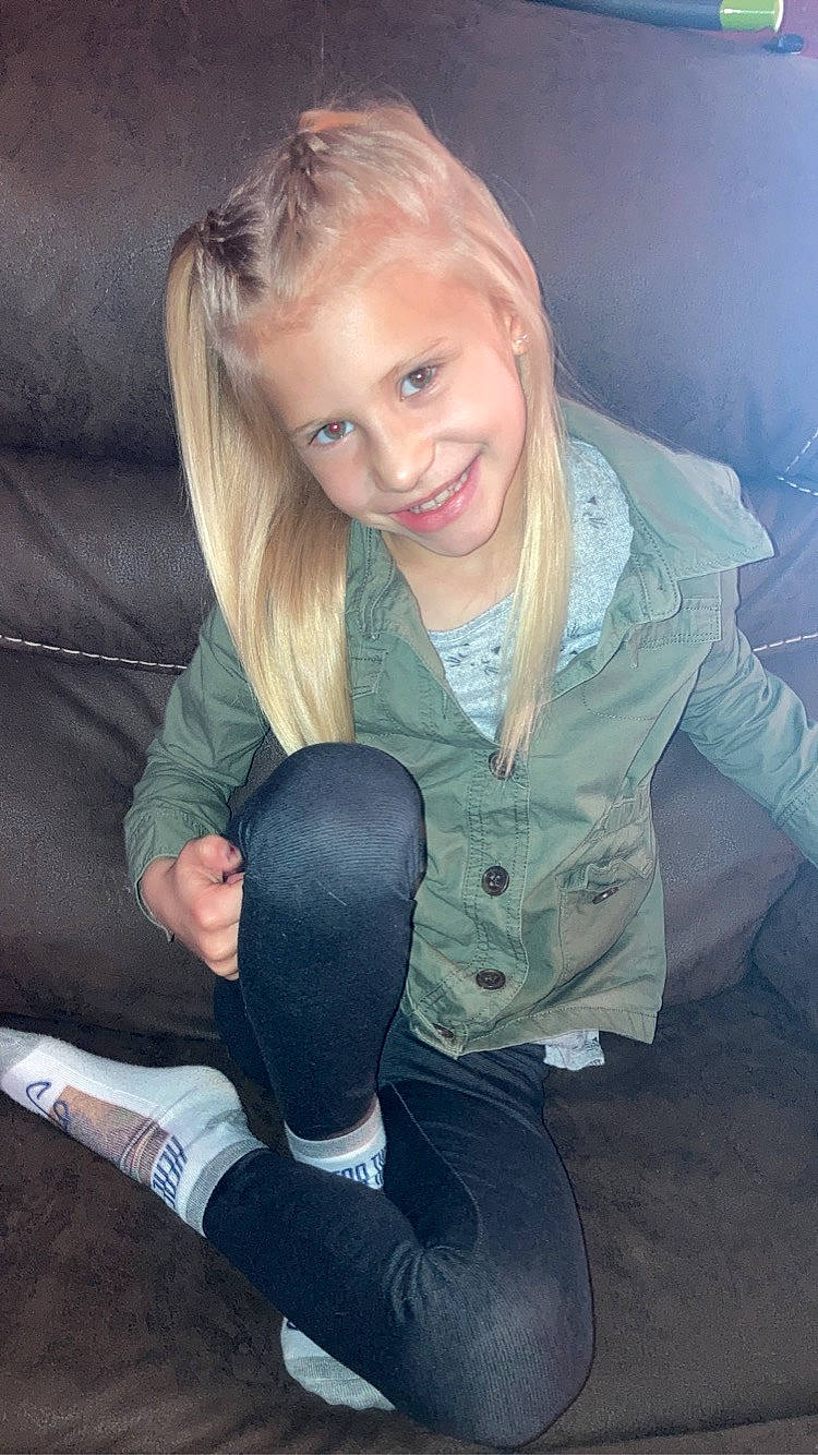 Aleeah is registered to the contest to win money with this photo: arm, comfort, cool, dress, facial_expression, finger, flash_photography, fun, gesture, glove, hair, hairstyle, happy, head, human_body, joy, knee, lap, person, skin