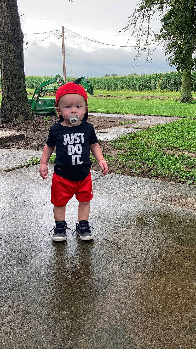 Ryker joined the competition — help win amazing prizes! asphalt, baby, baby_toddler_clothing, electric_blue, fun, grass, happy, hat, headgear, headwear, landscape, leisure, person, plant, recreation, road_surface, shorts, sky, sneakers, t_shirt