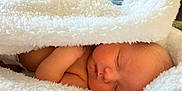 Lucian is registered to the contest to win money with this photo: baby, blanket, face, head, newborn, person, photography, portrait, quilt, sleeping, towel