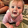 baby, child, infant, pink_shirt, carpet, indoor, person, face, hands, eyes, mouth, curious, crawling, adult, background, furniture, home, floor, casual, expression