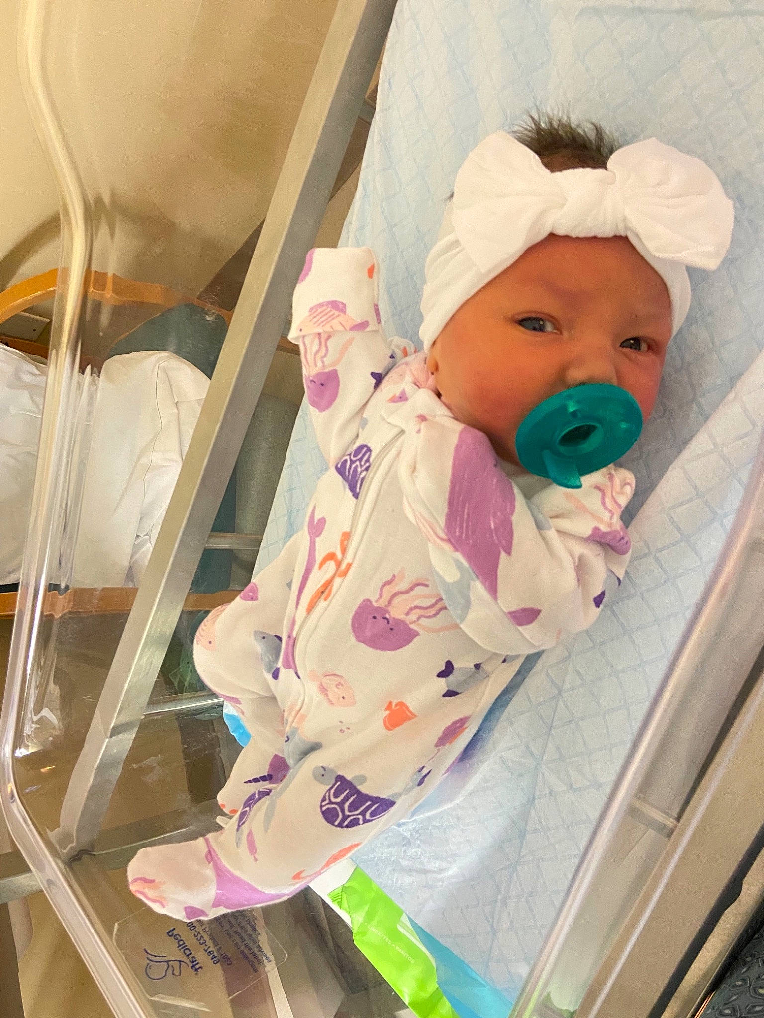 Adley joined the competition — help win amazing prizes! baby, baby_products, baby_safety, baby_sleeping, baby_toddler_clothing, baby_toys, beanie, cap, cheek, child, comfort, headwear, infant_bed, linens, person, pink, product, room, sitting, skin