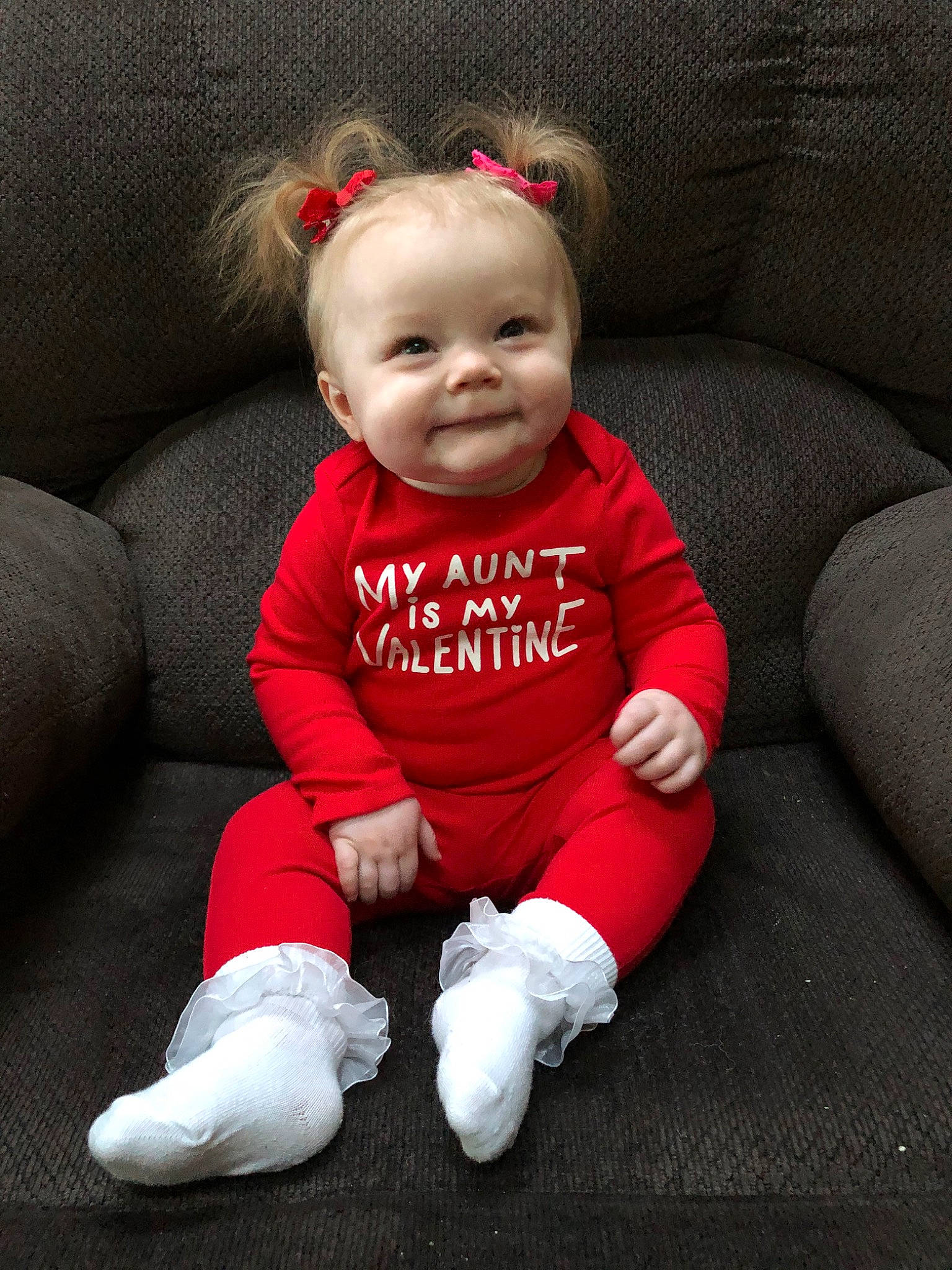 Kinzley is registered to the contest to win money with this photo: baby, baby_toddler_clothing, cheek, child, crawling, head, lip, person, red, sitting, skin, sleeve, smile, toddler