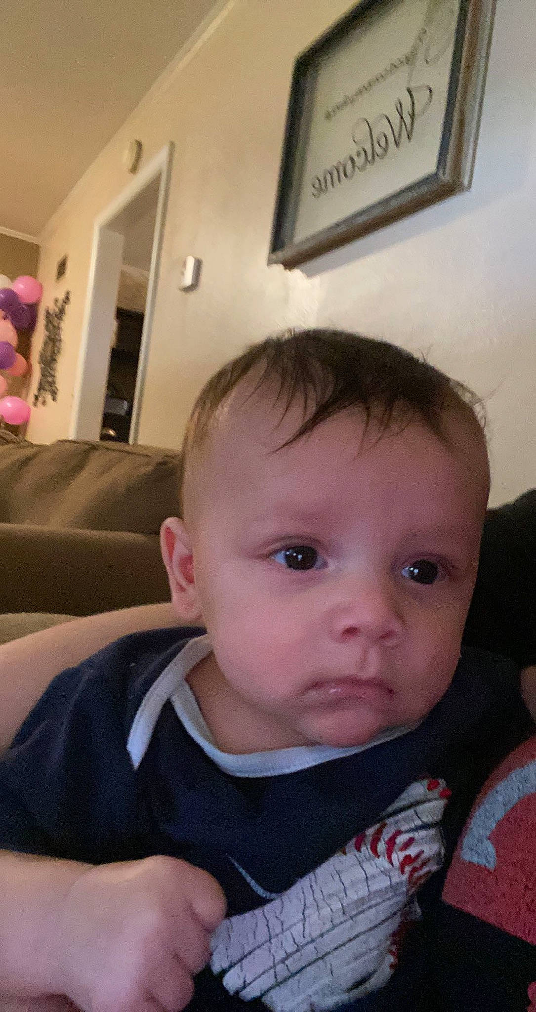 Khamari is registered to the contest to win money with this photo: baby, baby_toddler_clothing, chair, cheek, child, chin, comfort, ear, eyelash, facial_expression, forehead, fun, iris, lip, mouth, nose, person, picture_frame, sitting, skin