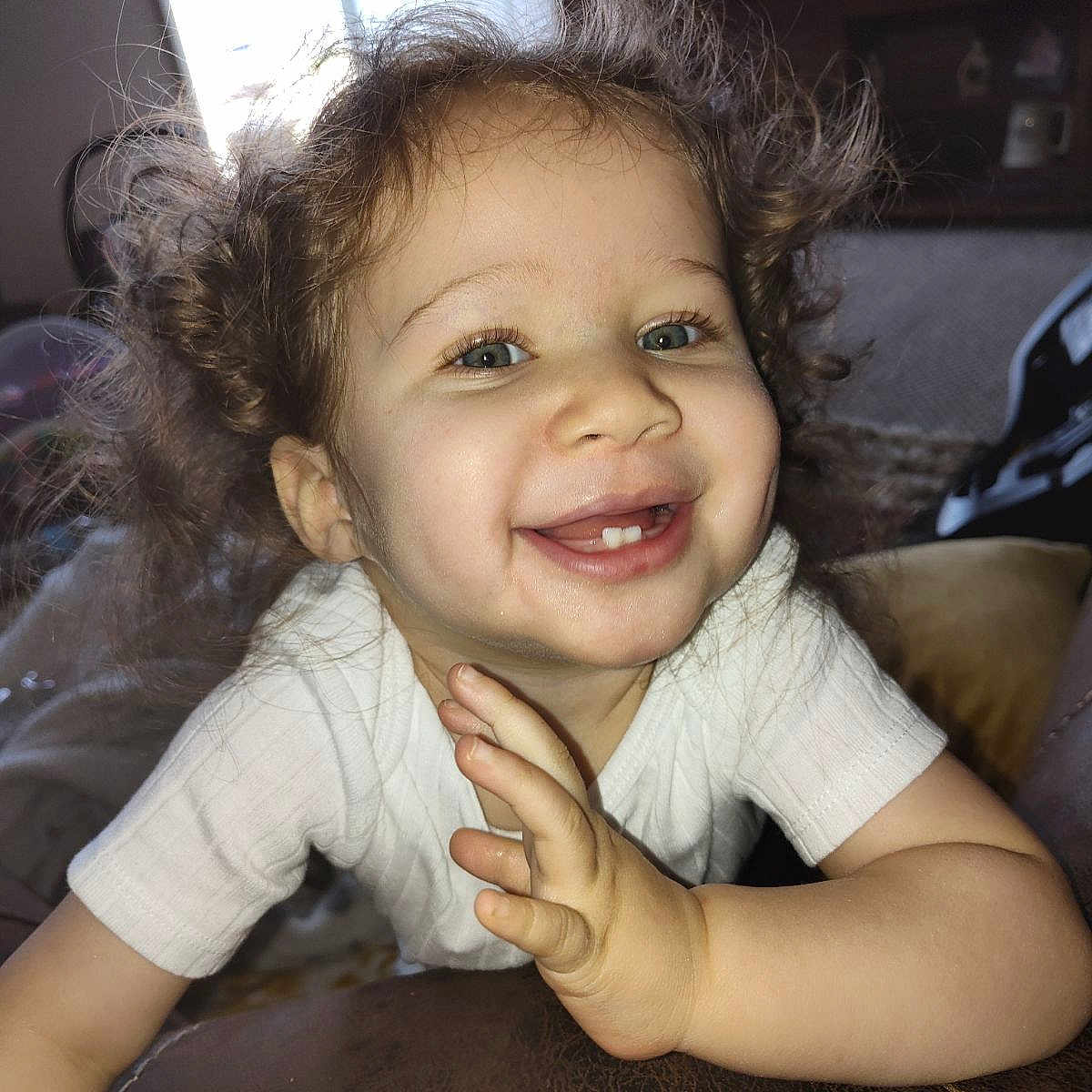 Alyssa is registered to the contest to win money with this photo: accessories, baby, babylaughing, blonde, bodypart, cosmetics, cushion, face, hair, happy, head, homedecor, laughing, lipstick, mouth, person, photography, portrait, smile, teeth