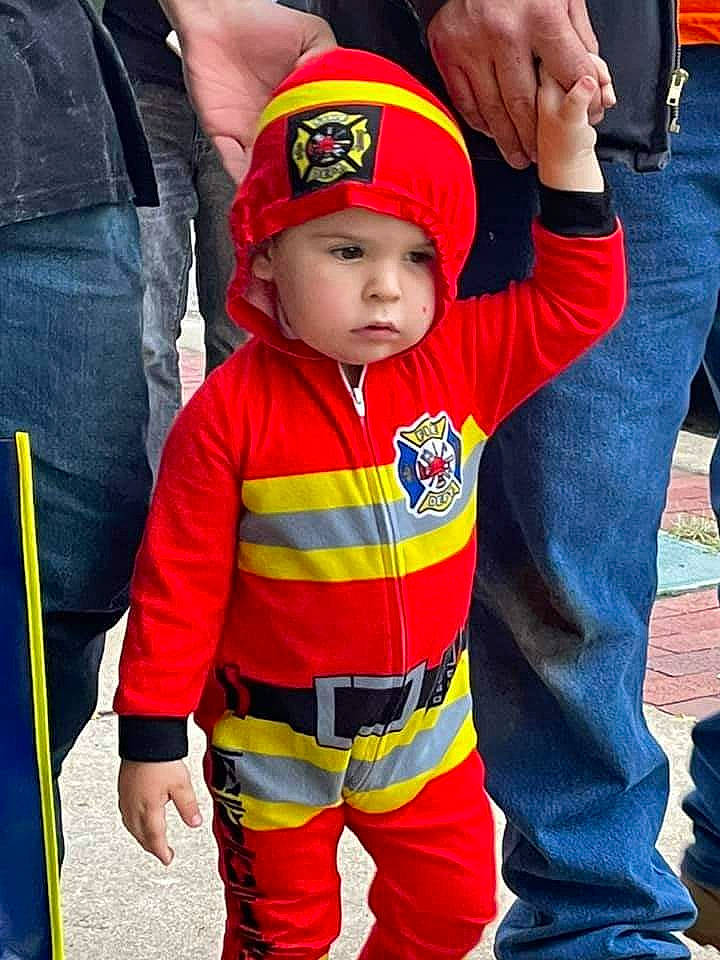 Landon is registered to the contest to win money with this photo: baby, baby_toddler_clothing, baseball_cap, cap, carmine, child, costume_hat, event, fictional_character, fun, happy, headgear, headwear, lifejacket, orange, person, personal_protective_equipment, red, shoe, sleeve
