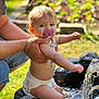 Ambre participe au concours pour gagner de l'argent avec cette photo : baby, child, pacifier, diaper, water, splashing, hands, adult, outdoor, sunlight, garden, rocks, playing, happy, skin, closeup, summer, nature, fun, tender