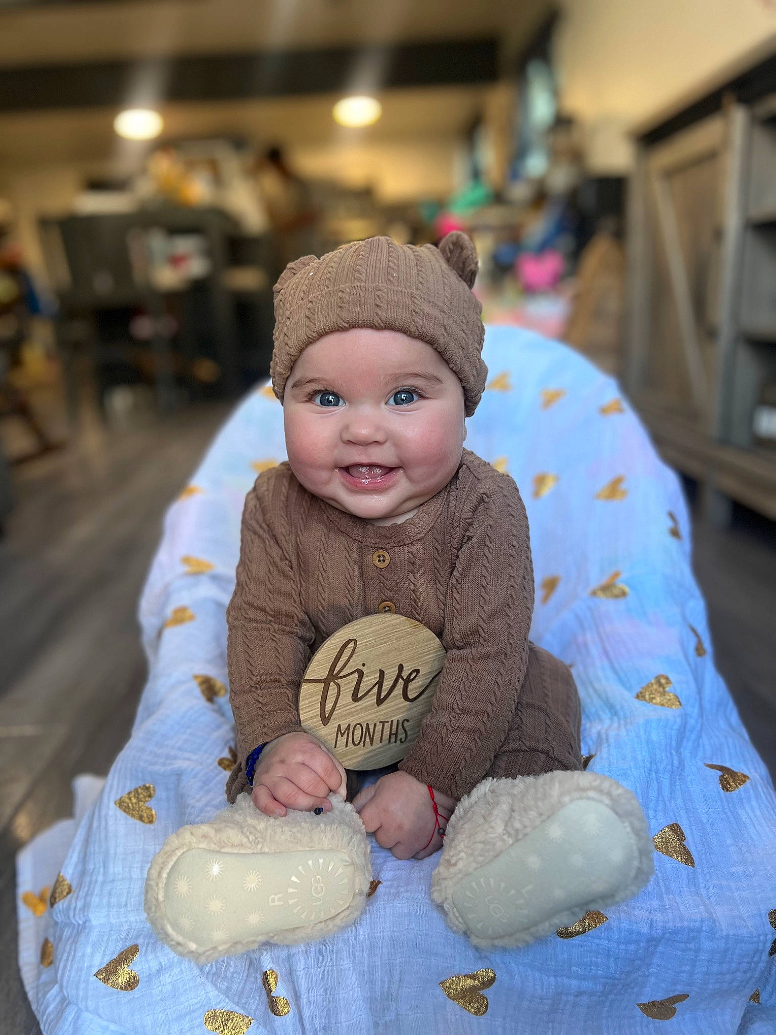 Avianna is registered to the contest to win money with this photo: baby, baby_sleeping, baby_toddler_clothing, beanie, cap, cheek, child, event, happy, hat, headgear, headwear, joy, knit_cap, person, room, sitting, skin, smile, textile
