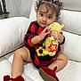 Allison joined the competition — help win amazing prizes! toddler, child, curly_hair, bow, red_dress, plush_toy, white_couch, red_shoes, sitting, indoor, cute, smiling, baby, toy, furniture, person, young_child, comfortable, home, playful