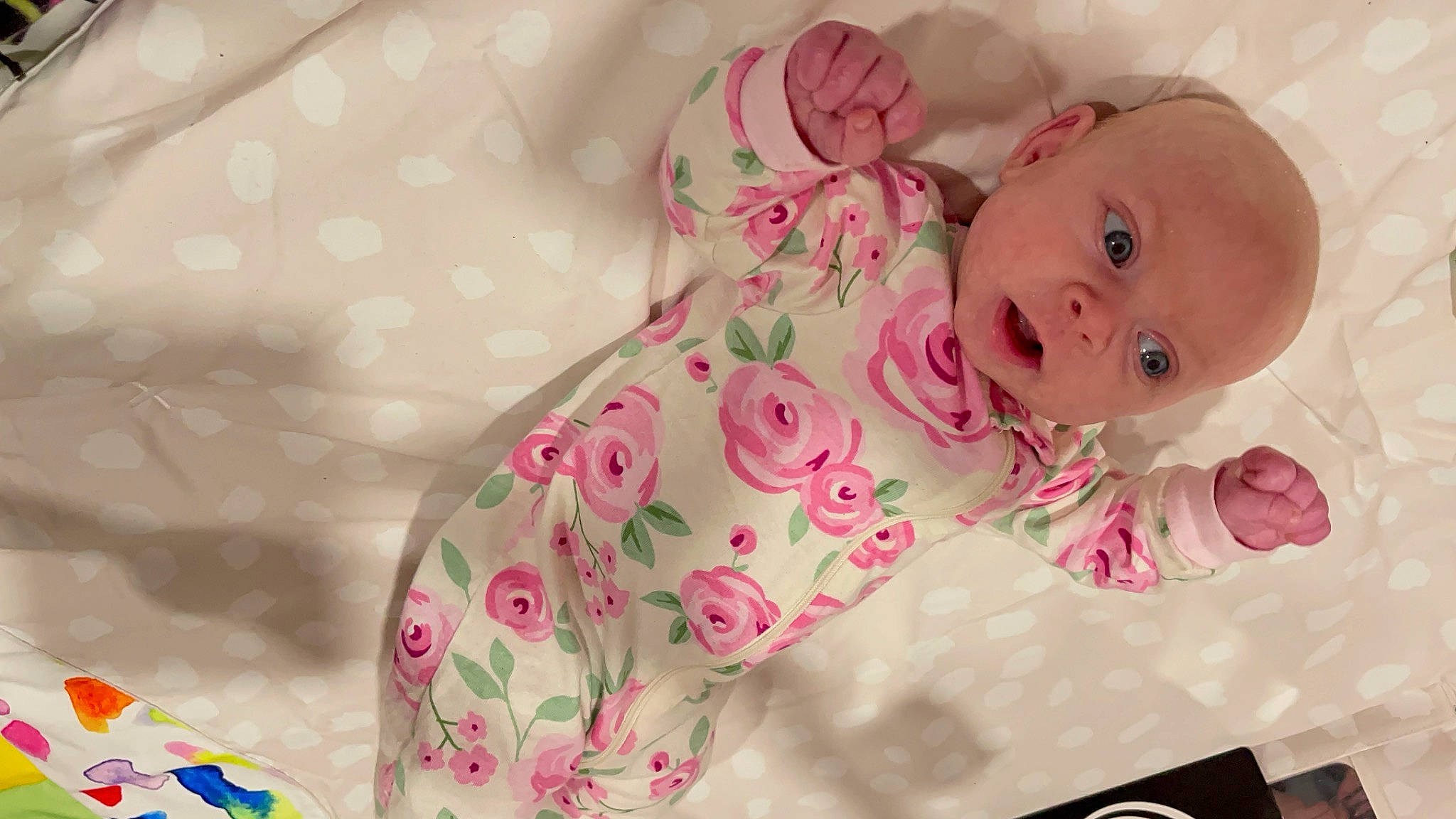 Celeste is registered to the contest to win money with this photo: baby, baby_products, baby_safety, baby_sleeping, baby_toddler_clothing, baby_toys, bedding, cheek, child, comfort, eye, linens, lip, magenta, pattern, person, petal, pink, sleeve, textile