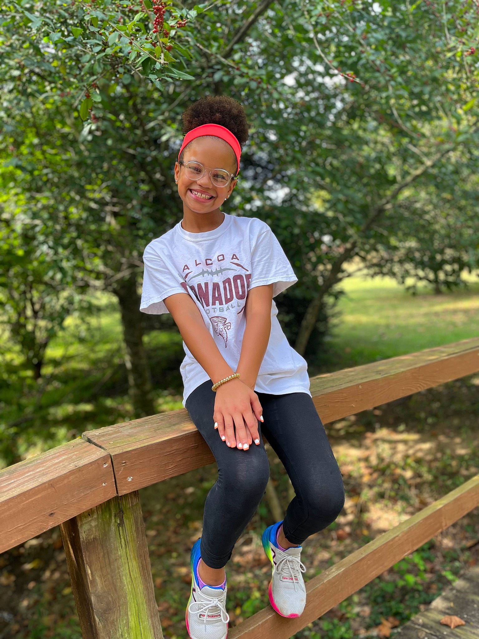 Acelynn is registered to the contest to win money with this photo: baseball_cap, cap, electric_blue, grass, happy, headwear, human_leg, joy, knee, leisure, magenta, pattern, people_in_nature, person, recreation, sleeve, smile, sportswear, summer, t_shirt